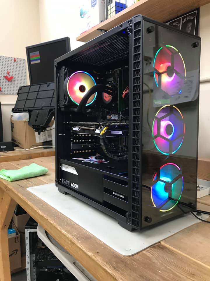 Computer technician repairing business desktop hardware in Lincoln Nebraska office