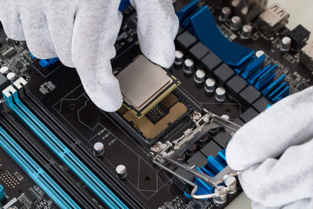 Person Installing Central Processor In Motherboard