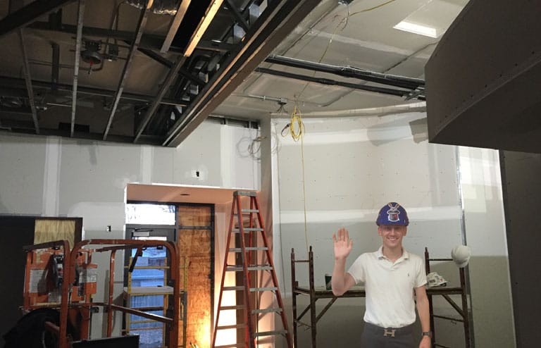 Technician installing a business network firewall in a Lincoln Nebraska office