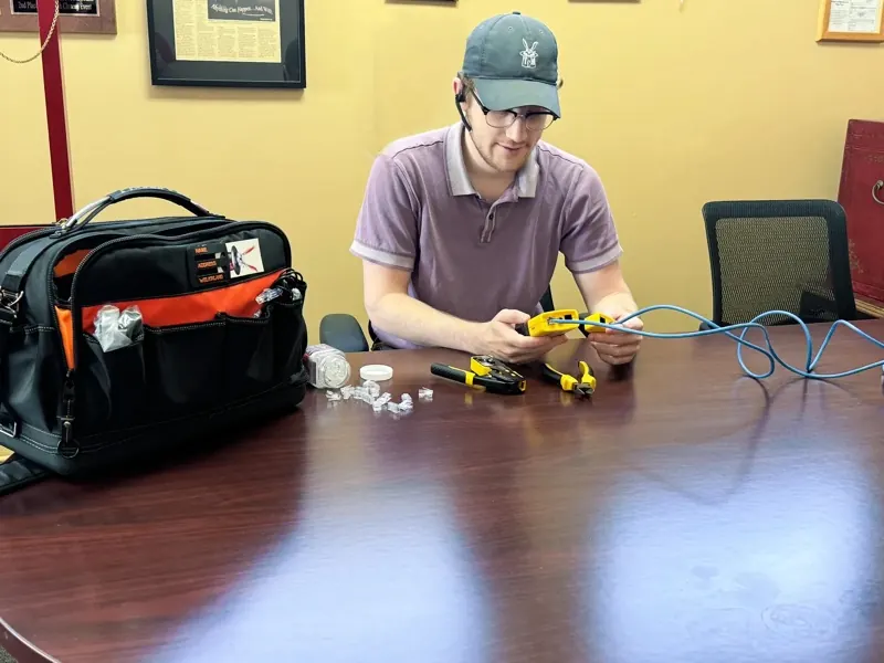 The Computer Magician technician installing network cabling